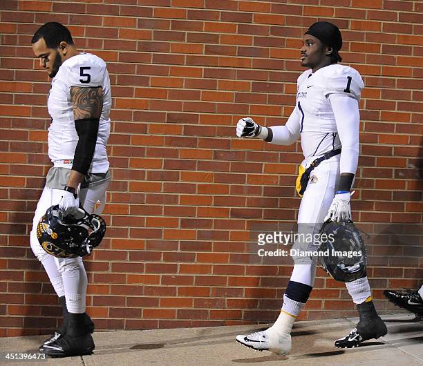 Defensive linemen Roosevelt Nix and running back Dri Archer of the Kent State Golden Flashes walks to the field before a game against the Ohio...