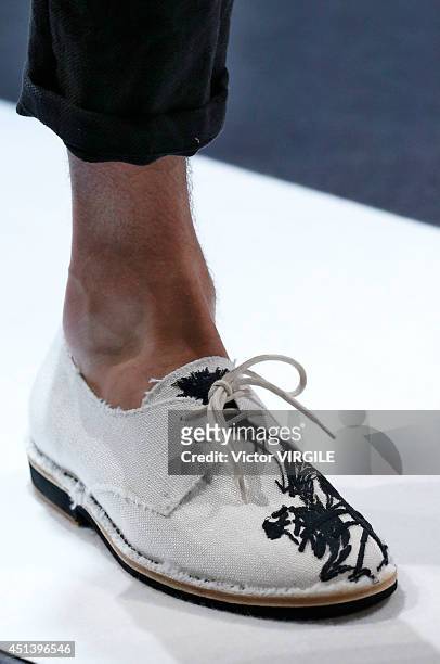 Model walks the runway during the Ann Demeulemeester show as part of the Paris Fashion Week Menswear Spring/Summer 2015 on June 27, 2014 in Paris,...