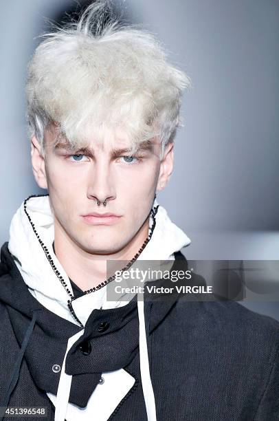 Model walks the runway during the Ann Demeulemeester show as part of the Paris Fashion Week Menswear Spring/Summer 2015 on June 27, 2014 in Paris,...