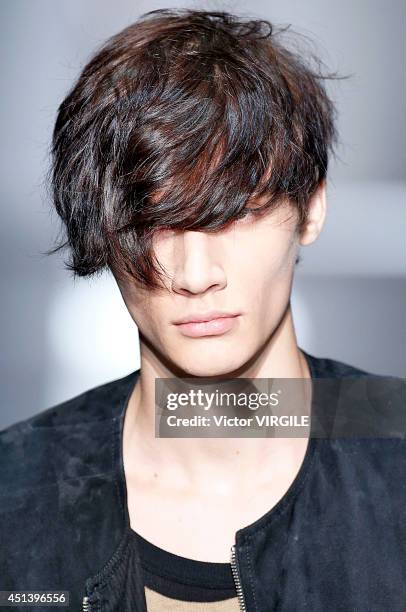 Model walks the runway during the Ann Demeulemeester show as part of the Paris Fashion Week Menswear Spring/Summer 2015 on June 27, 2014 in Paris,...