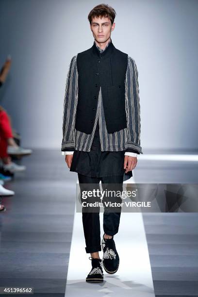 Model walks the runway during the Ann Demeulemeester show as part of the Paris Fashion Week Menswear Spring/Summer 2015 on June 27, 2014 in Paris,...