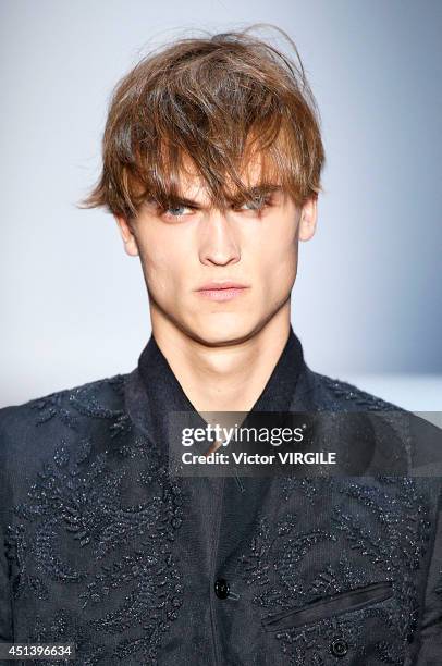 Model walks the runway during the Ann Demeulemeester show as part of the Paris Fashion Week Menswear Spring/Summer 2015 on June 27, 2014 in Paris,...