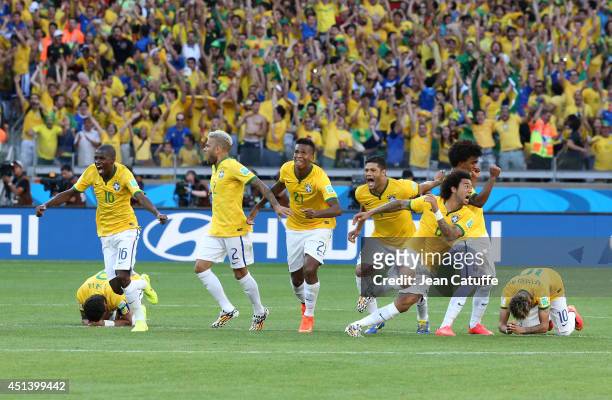 Thiago Silva, Ramires, Dani Alves, Jo, Marcelo, Hulk, Willian and Neymar of Brazil celebrate the victory after the penalty shootout of the 2014 FIFA...