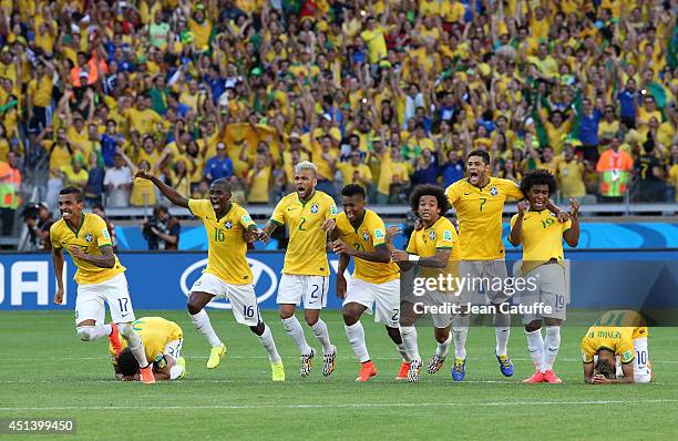 Luiz Gustavo, Ramires, Dani Alves, Jo, Marcelo, Hulk, Willian and Neymar of Brazil celebrate the victory after the penalty shootout of the 2014 FIFA...