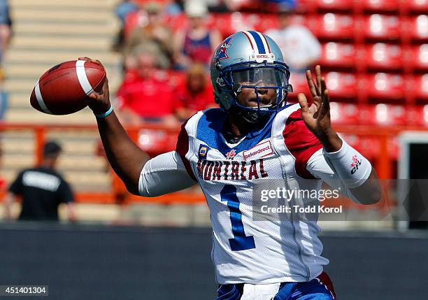 Quarterback Troy Smith of the Montreal Alouettes throws the ball in the second half of their CFL football game against the Calgary Stampeders at...