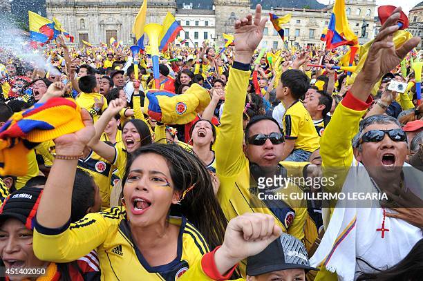 Colombian fans celebrate during the live broadcasting of the Brazil 2014 FIFA World Cup Round of 16 football match between Colombia and Uruguay, in...