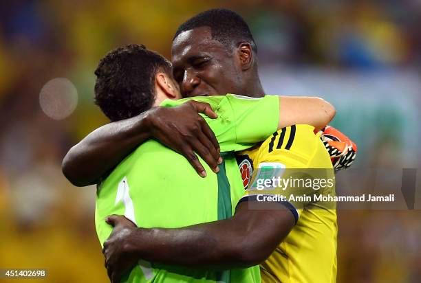 Cristian Zapata and David Ospina of Colombia Celebrate after defeating Uruguay 2-0 during the 2014 FIFA World Cup Brazil round of 16 match between...