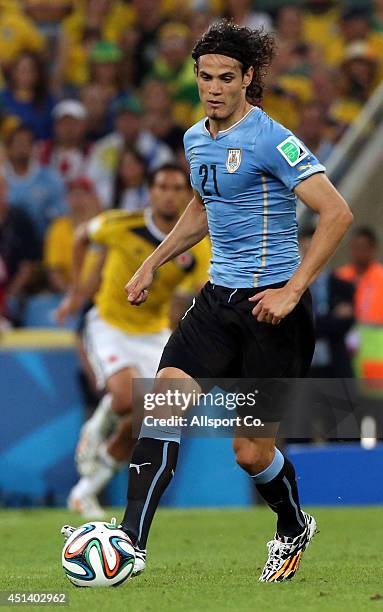 Edison Cavani of Uruguay runs with the ball during the 2014 FIFA World Cup Brazil Round of 16 match between Colombia and Uruguay at Maracana on June...