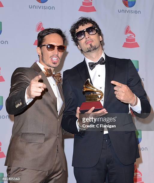 Recording artists Emmanuel Horvilleur and Dante Spinetta of Illya Kuryaki and the Valderramas pose backstage during The 14th Annual Latin GRAMMY...