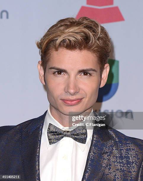 Actor Christian Acosta poses backstage during The 14th Annual Latin GRAMMY Awards at the Mandalay Bay Events Center on November 21, 2013 in Las...