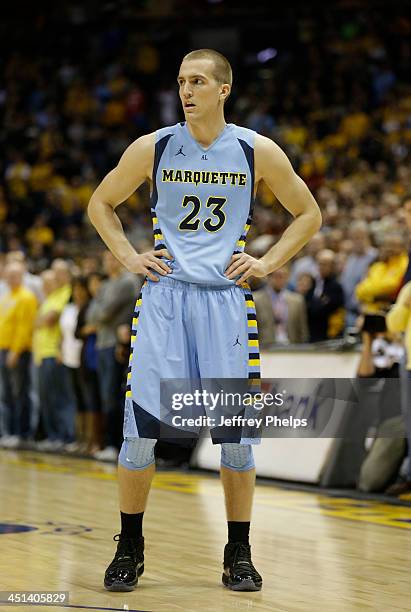 Jake Thomas of the Marquette Golden Eagles in action against the Ohio State Buckeyes at BMO Harris Bradley Center on November 16, 2013 in Milwaukee,...