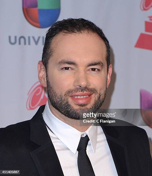 Singer/songwriter Santiago Cruz poses backstage during the 14th Annual Latin GRAMMY Awards at Mandalay Bay Events Center on November 21, 2013 in Las...