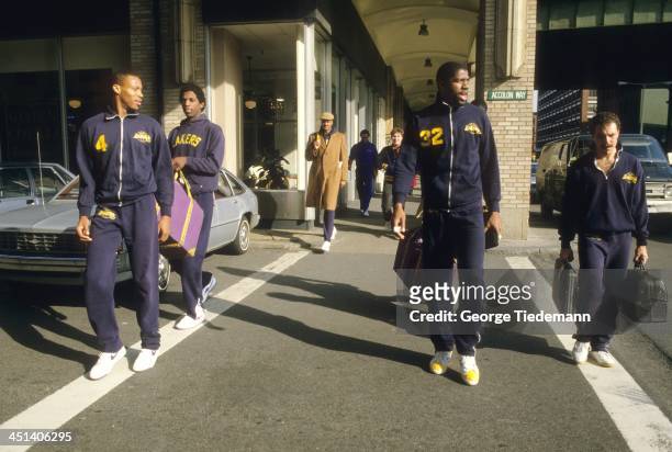 Los Angeles Lakers Byron Scott, A.C. Green, Magic Johnson, and trainer Gary Vitti approaching arena before practice and game vs Boston Celtics at...