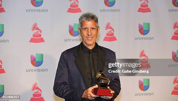 Songwriter Cachorro Lopez, winner of Best Rock Song for "Creo Que Me Enamore" poses in the press room during The 14th Annual Latin GRAMMY Awards at...