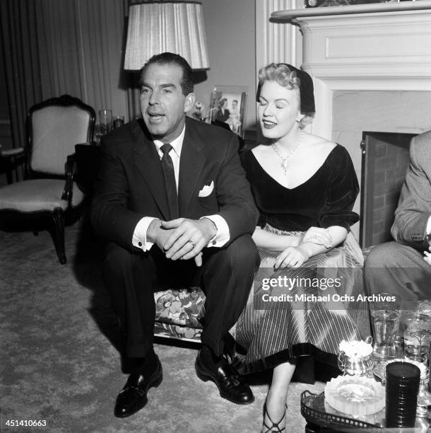 Actress June Haver and husband actor Fred MacMurray attend a party in Los Angeles, California.