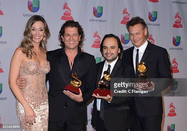 Claudia Vasquez, Singer Carlos Vives and Andres Castro pose backstage at the 14th Annual Latin GRAMMY Awards at Mandalay Bay Events Center on...