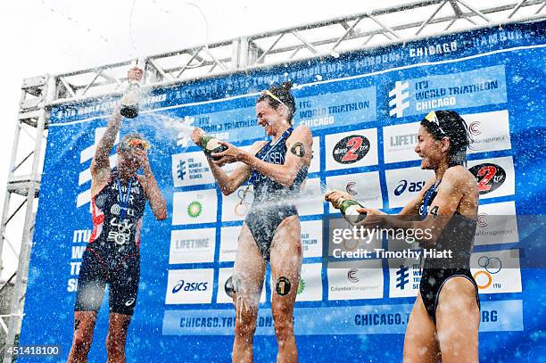 Helen Jenkins of Great Britain, Gwen Jorgensen of the United States and Juri Ide of Japan celebrate their wins at the Elite Women's race in the 2014...