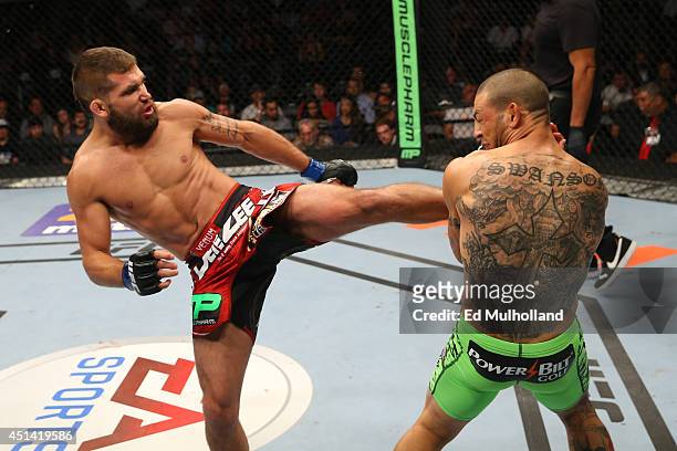 Jeremy Stephens kicks Cub Swanson in their featherweight bout at the AT&T Center on June 28, 2014 in San Antonio, Texas.