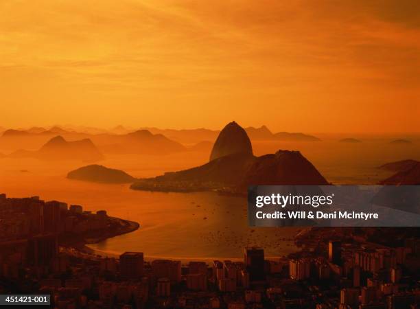 brazil, rio de janiero, city and sugarloaf mountain at sunset - rio de janeiro ストックフォトと画像