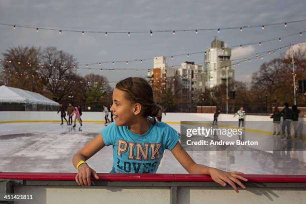 Girl holds on to the railing while ice skating at the ice rink at McCarren Pool, which opened for the winter months last week, on November 22, 2013...