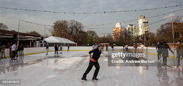 People ice skate at the ice rink at McCarren Pool, which opened for the winter months last week, on November 22, 2013 in the Green Point neighborhood...
