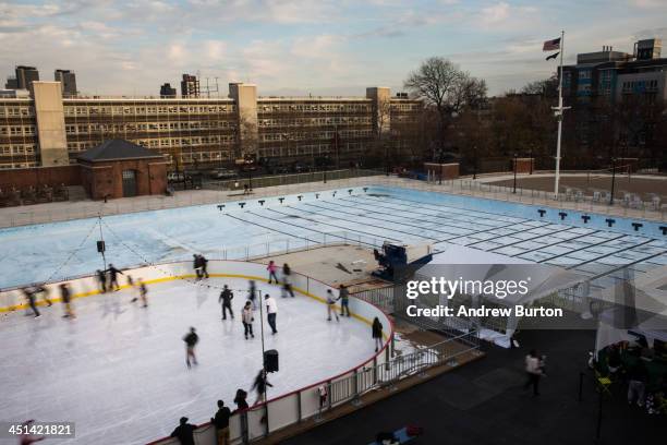 People skate on the ice rink at McCarren Pool, which opened for the winter months last week, on November 22, 2013 in the Green Point neighborhood of...