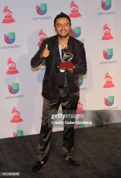 Singer Alex Campos, winner of Best Spanish Christian Album for "Regreso A Ti," poses in the press room during The 14th Annual Latin GRAMMY Awards at...