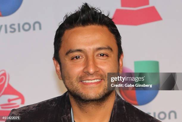 Singer Alex Campos, winner of Best Spanish Christian Album for "Regreso A Ti," poses in the press room during The 14th Annual Latin GRAMMY Awards at...