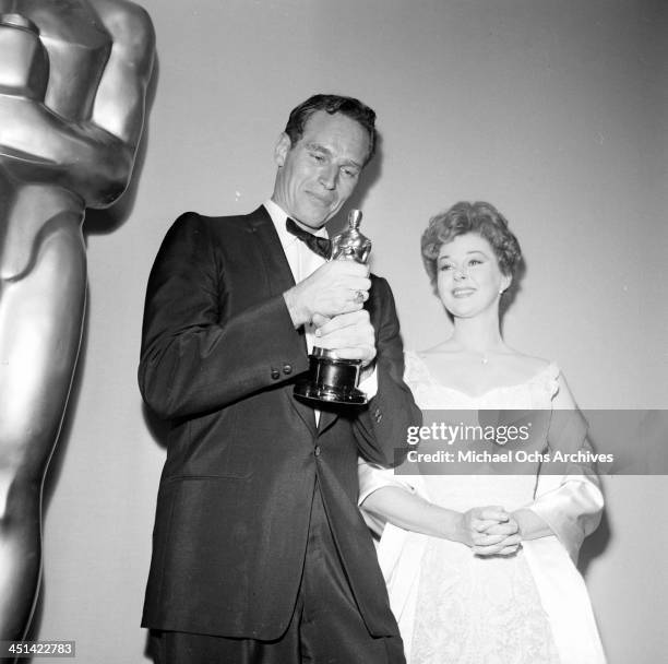 Actor Charlton Heston poses with Susan Hayward after winning the Academy Award for "Ben Hur" in Los Angeles, California.