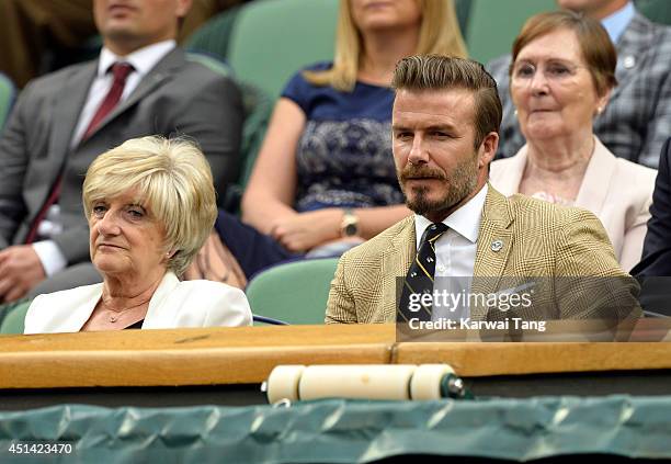 Sandra Beckham and David Beckham attend the Mikhail Kuskushkin v Rafael Nadal match on centre court during day six of the Wimbledon Championships at...