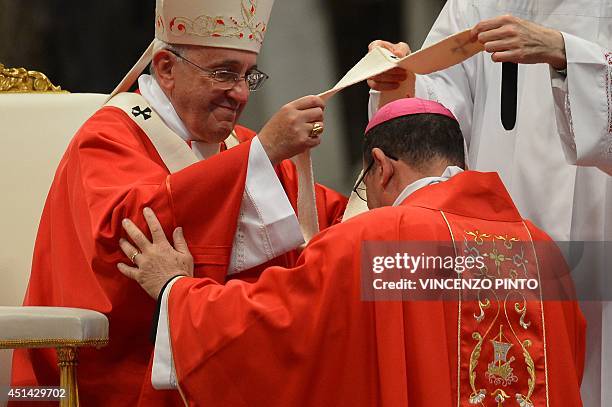 New archbishop of Antsiranana Marc Balthason Ramaroson receives the Pallium from Pope Francis during a mass for the new metropolitan archbishops and...