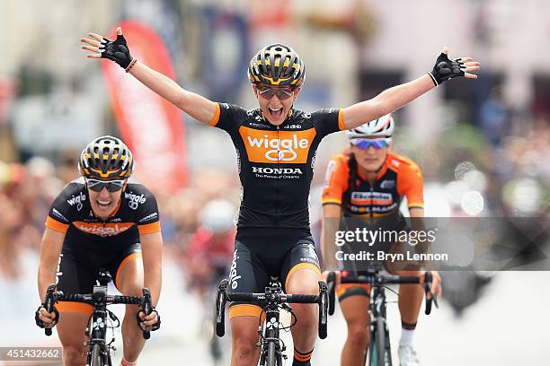 Laura Trott of Wiggle Honda celebrates crossing the finish line to win the Elite Women British National road race championships on June 29, 2014 in...