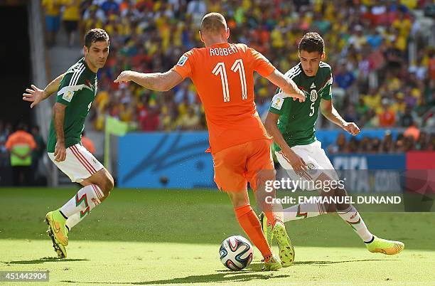 Mexico's defender and captain Rafael Marquez and Mexico's defender Diego Reyes prepare to tackle Netherlands' forward Arjen Robben during a Round of...