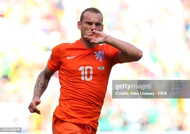 Wesley Sneijder of the Netherlands celebrates scoring his team's first goal during the 2014 FIFA World Cup Brazil Round of 16 match between...