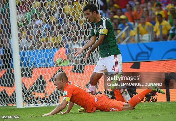 Mexico's defender and captain Rafael Marquez reacts after the awarding of a penalty after a tackle on Netherlands' forward Arjen Robben during a...