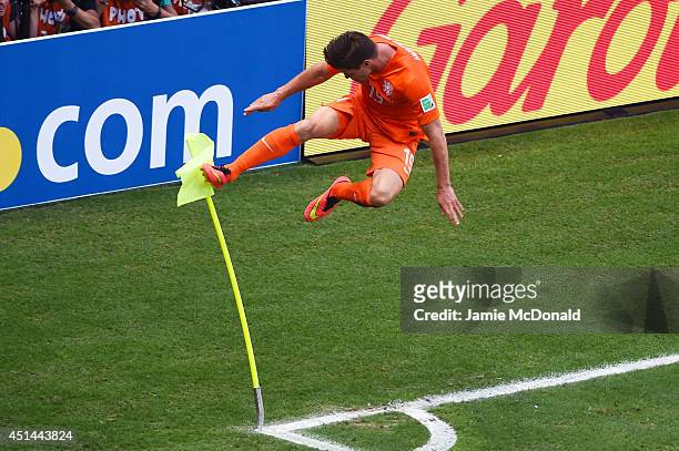 Klaas-Jan Huntelaar of the Netherlands celebrates scoring his team's second goal on a penalty kick in stoppage time during the 2014 FIFA World Cup...