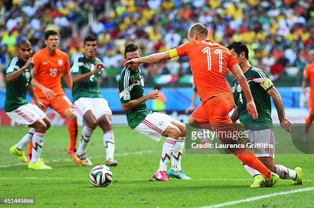 Arjen Robben of the Netherlands is tripped by Rafael Marquez of Mexico for a penalty during the 2014 FIFA World Cup Brazil Round of 16 match between...
