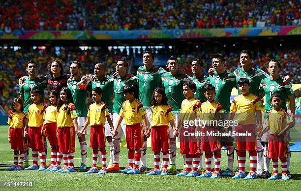 Mexico line up for the National Anthem prior to the 2014 FIFA World Cup Brazil Round of 16 match between Netherlands and Mexico at Castelao on June...