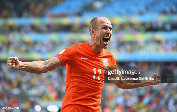 Arjen Robben of the Netherlands celebrates after defeating Mexico 2-1 during the 2014 FIFA World Cup Brazil Round of 16 match between Netherlands and...