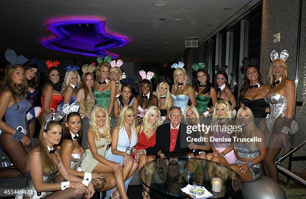 Hugh Hefner With Playboy Bunnies And Girlfriends during The Palms Casino Celebrates Playboy's 50th Anniversary With Private Reception At Ghost Bar at...