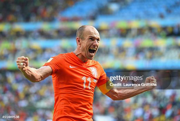 Arjen Robben of the Netherlands celebrates after defeating Mexico 2-1 during the 2014 FIFA World Cup Brazil Round of 16 match between Netherlands and...