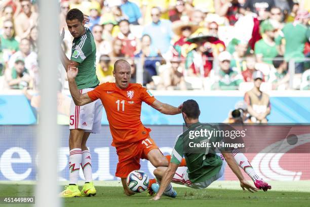 Diego Reyes of Mexico, Arjan Robben of Holland, Miguel Layun of Mexico during the 1/8 final match between The Netherlands and Mexico on June 29, 2014...