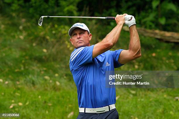 Bill Glasson hits his tee shot on the third hole during the final round of the Constellation Senior Players Championship at Fox Chapel Golf Club on...