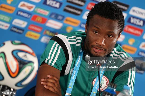 John Obi Mikel of Nigeria answers to the media during a press conference on the eve of the 2014 FIFA World Cup Brazil round of 16 match between...