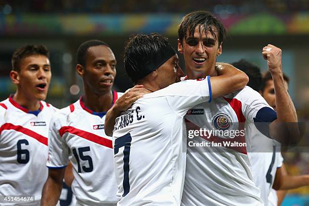 Bryan Ruiz celebrates with Christian Bolanos of Costa Rica scoring his team's first goal during the 2014 FIFA World Cup Brazil Round of 16 match...