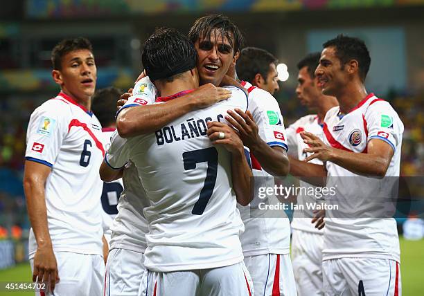 Bryan Ruiz celebrates scoring his team's first goal with Christian Bolanos of Costa Rica during the 2014 FIFA World Cup Brazil Round of 16 match...