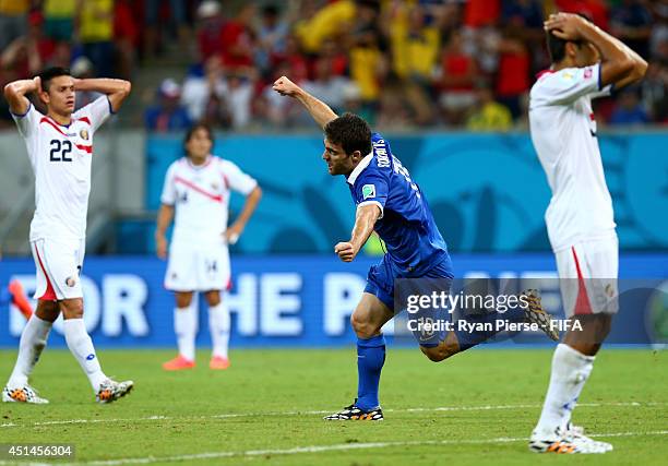 Sokratis Papastathopoulos of Greece celebrates scoring his team's first goal during the 2014 FIFA World Cup Brazil Round of 16 match between Costa...