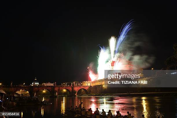 General view shows fireworks over the Tiber river and the Castel Sant'Angelo during the traditional 'Girandola' the feast of Romes patron St Peter...