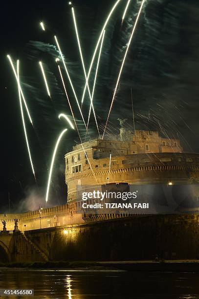 General view shows fireworks over the Tiber river and the Castel Sant'Angelo during the traditional 'Girandola' the feast of Romes patron St Peter...