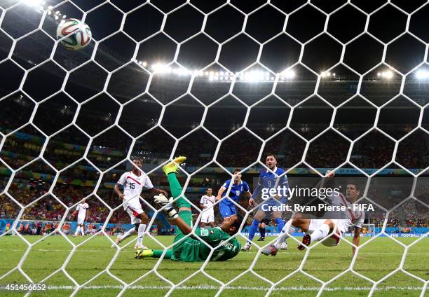 Sokratis Papastathopoulos of Greece scores his team's first goal past Keylor Navas of Costa Rica during the 2014 FIFA World Cup Brazil Round of 16...